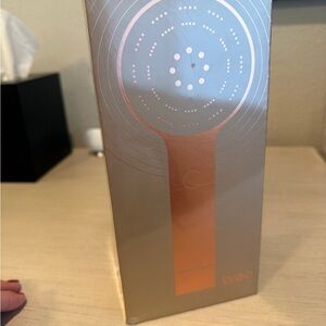 Breo Massager in Silver and Orange